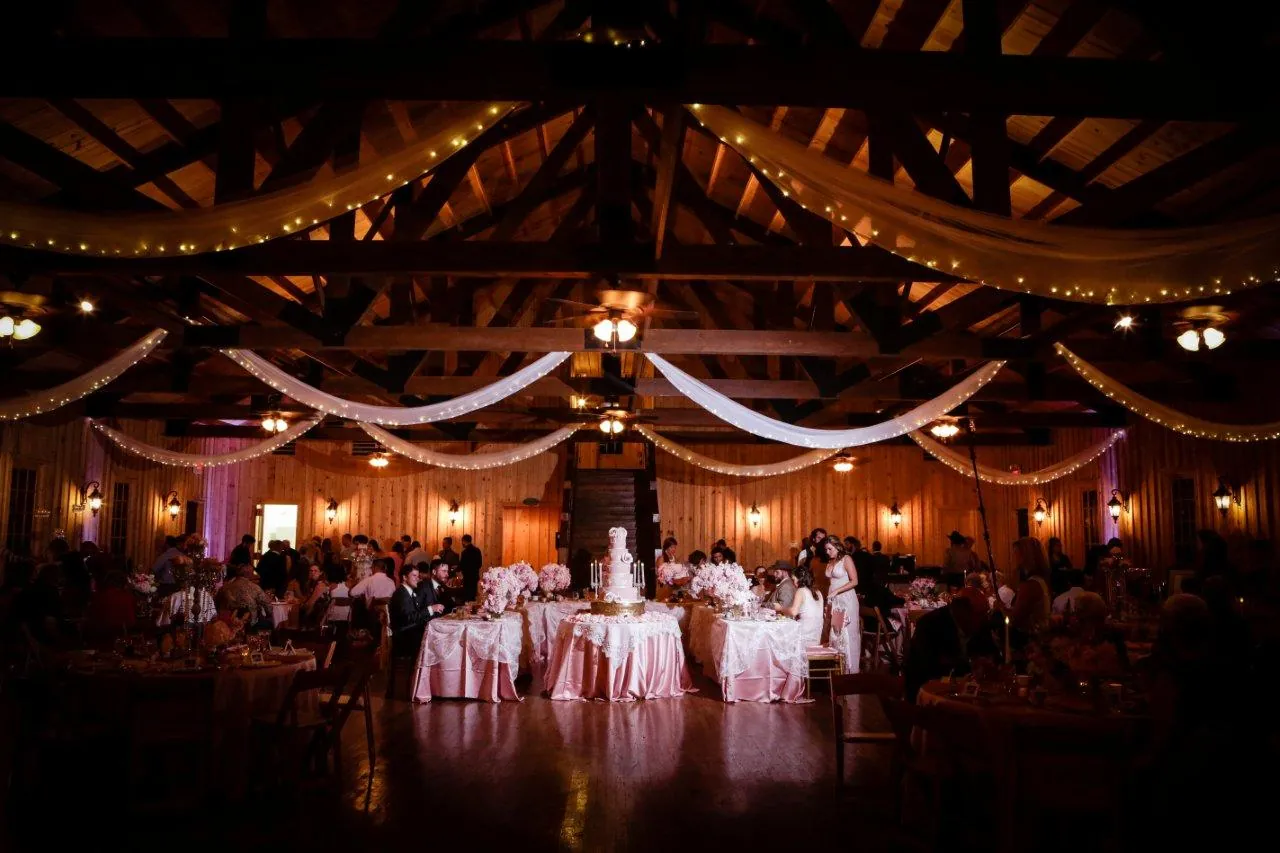 A reception hall under swags of string lights