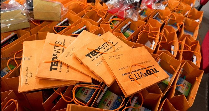 TEDxVITS delegate bags laid out in rows